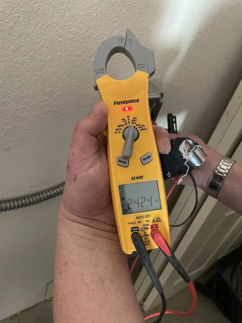 Voltage testing with clamp meter during Circuit Breaker Repair in Helena